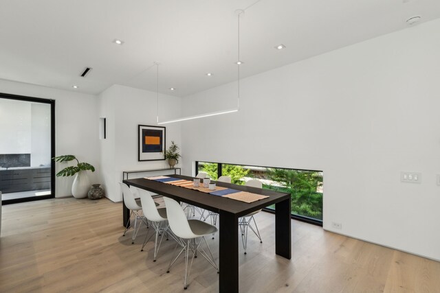 5101 Vickery Blvd, Dallas, TX 75206 - dining space with light wood-style flooring, recessed lighting, and a towering ceiling