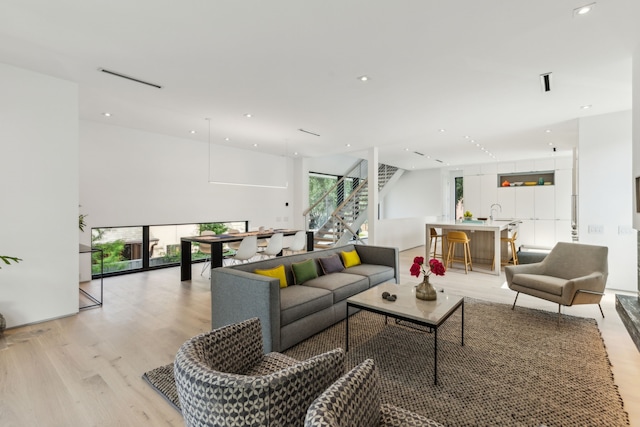 5101 Vickery Blvd, Dallas, TX 75206 - living room featuring light wood finished floors, stairs, and recessed lighting