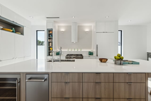5101 Vickery Blvd, Dallas, TX 75206 - kitchen with beverage cooler, modern cabinets, a sink, white cabinets, and recessed lighting