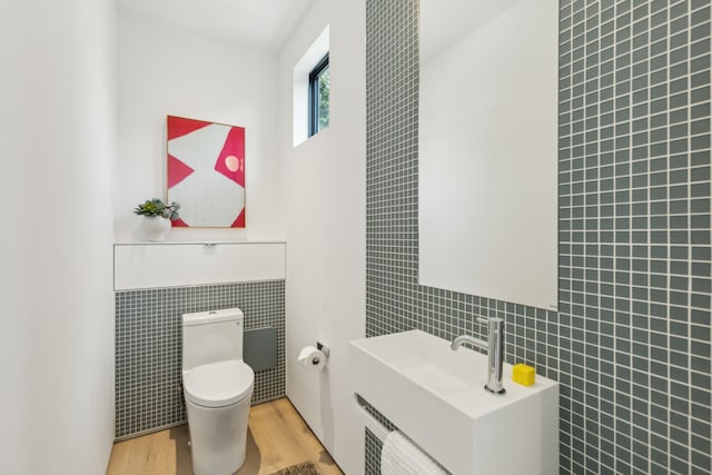 5101 Vickery Blvd, Dallas, TX 75206 - bathroom with tile walls, vanity, toilet, and wood finished floors