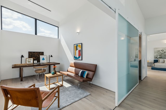 5101 Vickery Blvd, Dallas, TX 75206 - living area with light wood-style flooring, a high ceiling, and an office area