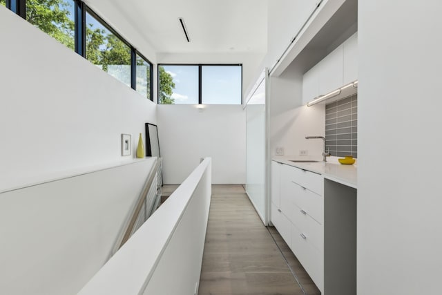 5101 Vickery Blvd, Dallas, TX 75206 - kitchen featuring a sink, modern cabinets, white cabinets, light countertops, and backsplash