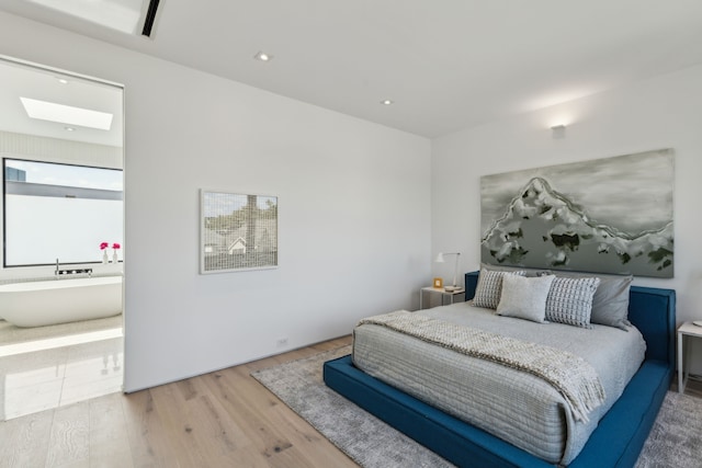 5101 Vickery Blvd, Dallas, TX 75206 - bedroom featuring a skylight, wood finished floors, and recessed lighting