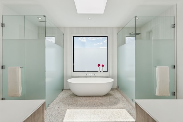 5101 Vickery Blvd, Dallas, TX 75206 - bathroom with a shower stall, a skylight, and a freestanding bath