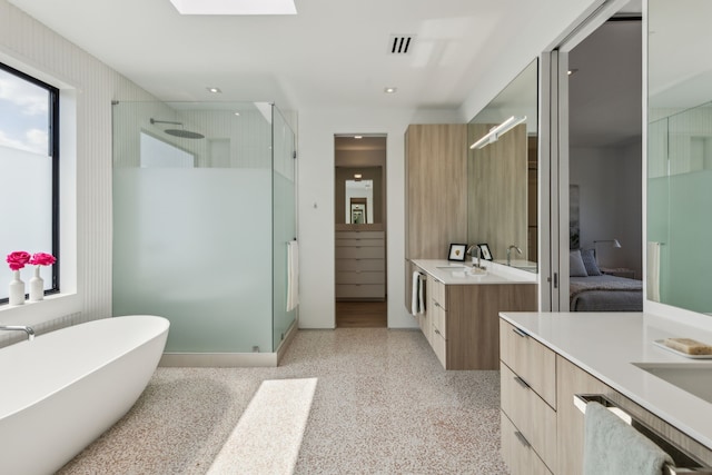5101 Vickery Blvd, Dallas, TX 75206 - ensuite bathroom featuring a shower stall, vanity, speckled floor, a freestanding tub, and recessed lighting
