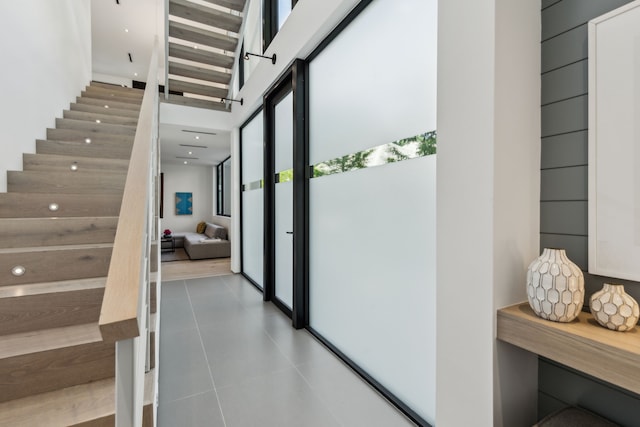 5101 Vickery Blvd, Dallas, TX 75206 - staircase with tile patterned floors and a towering ceiling
