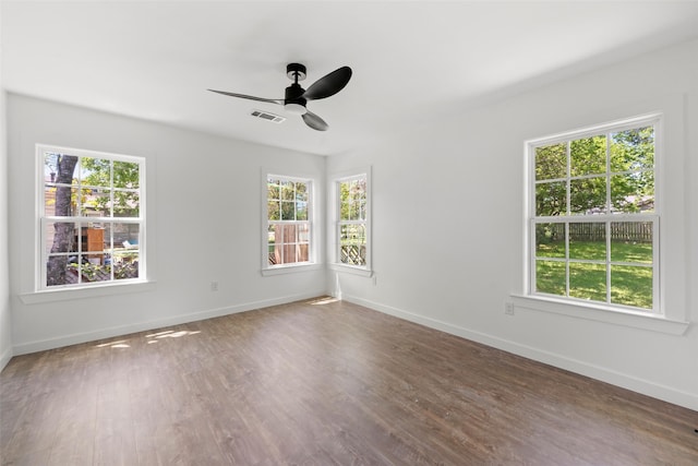 empty room with plenty of natural light, visible vents, baseboards, and ceiling fan