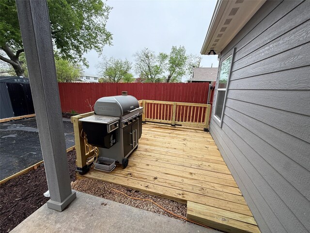 wooden deck featuring fence
