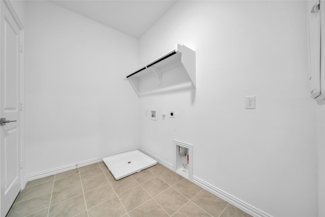 2949 Tenor Way, Sachse, TX 75048 - laundry room with hookup for an electric dryer, hookup for a gas dryer, light tile patterned floors, washer hookup, and laundry area