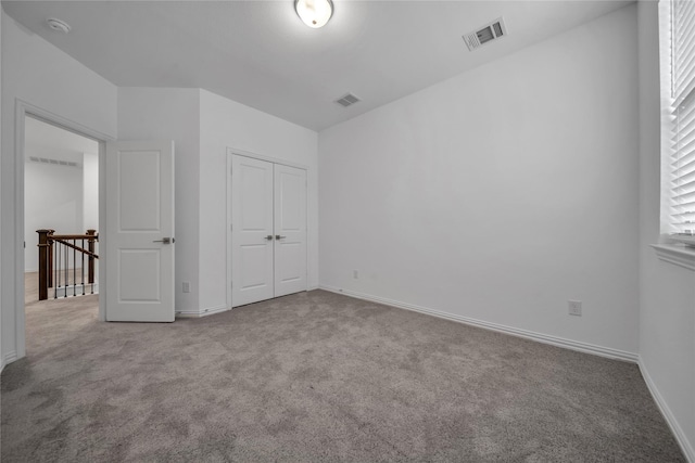 2949 Tenor Way, Sachse, TX 75048 - unfurnished bedroom featuring a closet, carpet flooring, baseboards, and visible vents