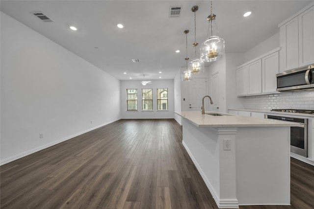 2949 Tenor Way, Sachse, TX 75048 - kitchen with appliances with stainless steel finishes, a sink, backsplash, and visible vents