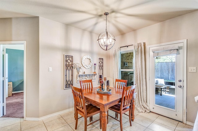 714 Lone Star Ct, Wylie, TX 75098 - dining room featuring a chandelier, light tile patterned flooring, and baseboards