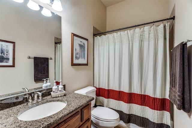 912 Lorene Dr, Wylie, TX 75098 - bathroom featuring toilet, vanity, a shower with curtain, and a textured wall