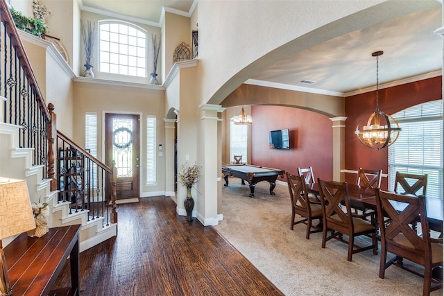912 Lorene Dr, Wylie, TX 75098 - carpeted entryway with a chandelier, arched walkways, healthy amount of natural light, a high ceiling, and ornamental molding