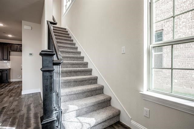 930 Estelle Dr, Euless, TX 76040 - stairs featuring baseboards, recessed lighting, and wood finished floors