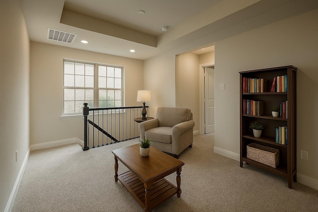 930 Estelle Dr, Euless, TX 76040 - sitting room with an upstairs landing, visible vents, baseboards, and carpet floors