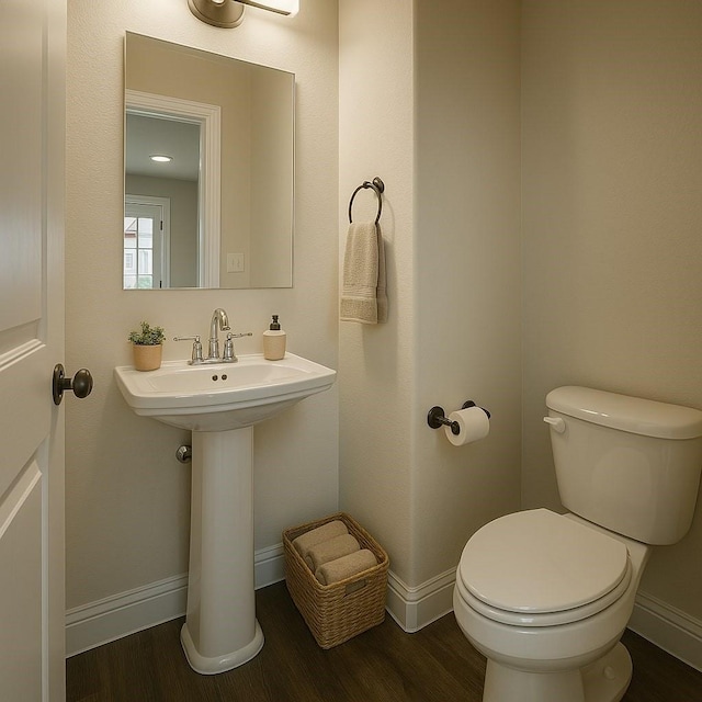 930 Estelle Dr, Euless, TX 76040 - bathroom featuring toilet, wood finished floors, and baseboards
