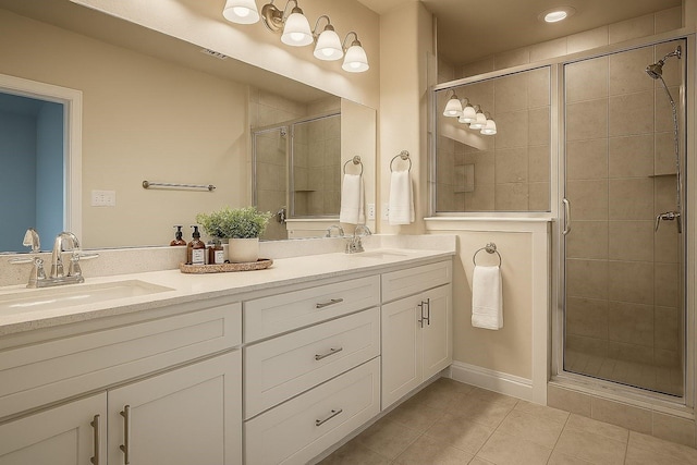 930 Estelle Dr, Euless, TX 76040 - bathroom with tile patterned floors, a sink, and a stall shower