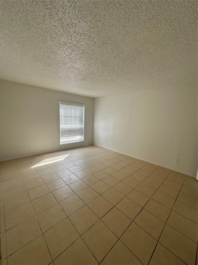 919 S Weatherred Dr Unit 113, Richardson, TX 75080 - tiled empty room with a textured ceiling