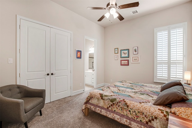 bedroom with a closet, visible vents, multiple windows, and light colored carpet