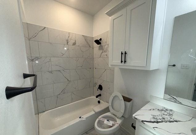 full bath with toilet, vanity, and shower / bathing tub combination