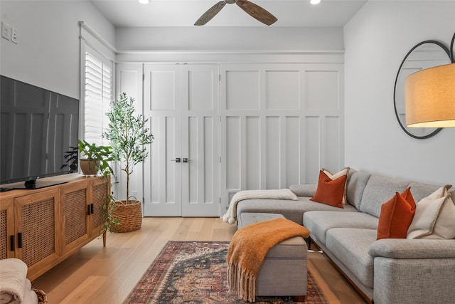 living area featuring light wood finished floors, recessed lighting, and a ceiling fan