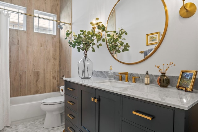 full bathroom with shower / bath combo with shower curtain, toilet, and vanity