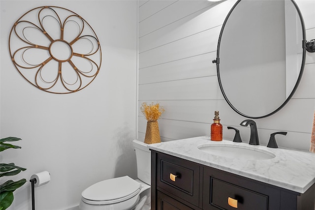 bathroom featuring toilet and vanity
