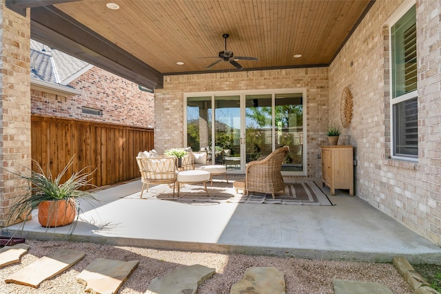 view of patio with fence, ceiling fan, and an outdoor hangout area