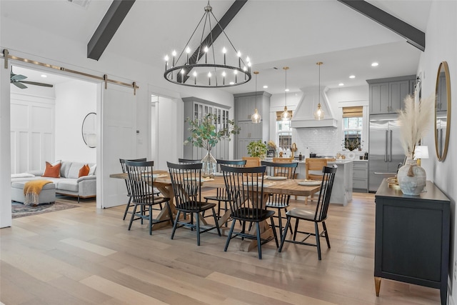 dining space featuring a barn door, lofted ceiling with beams, light wood-style floors, and recessed lighting