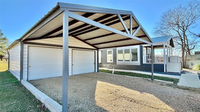 161 Pillsbury Cir, Quitman, TX 75783 - view of front of property featuring gravel driveway, an outdoor structure, and a detached garage