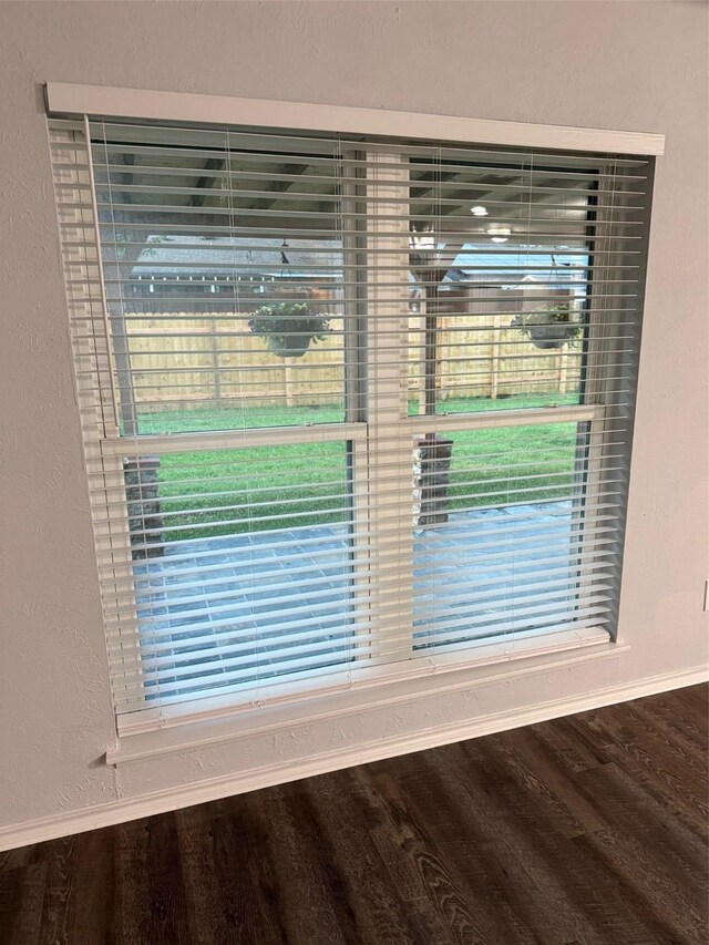 details with baseboards and wood finished floors