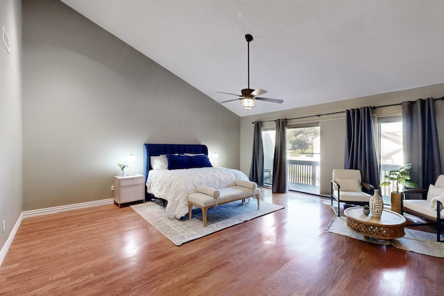 bedroom with ceiling fan, high vaulted ceiling, access to exterior, wood finished floors, and baseboards