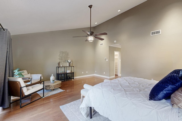 bedroom with wood finished floors, baseboards, visible vents, and recessed lighting