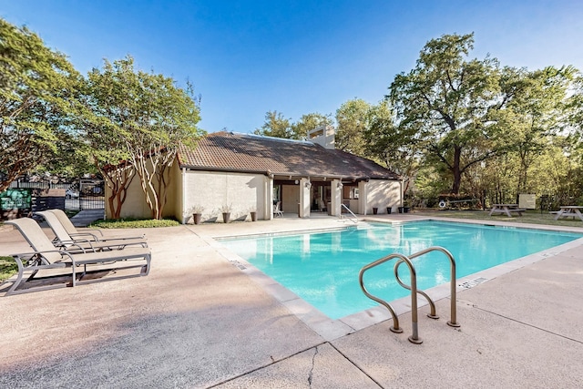 pool with a patio area