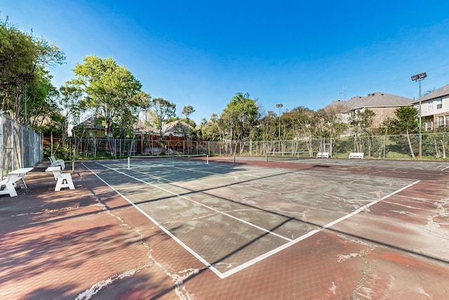 view of sport court with fence