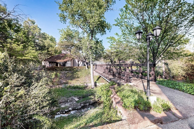 view of home's community with fence