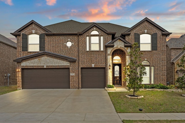 1136 Chickadee Dr, Forney, TX 75126 - french country home featuring brick siding, driveway, a lawn, an attached garage, and a shingled roof