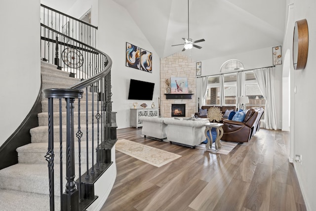 1136 Chickadee Dr, Forney, TX 75126 - living room with ceiling fan, high vaulted ceiling, stairway, and wood finished floors