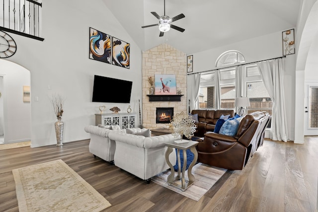 1136 Chickadee Dr, Forney, TX 75126 - living area featuring arched walkways, ceiling fan, a fireplace, high vaulted ceiling, and wood finished floors