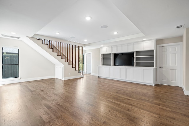 5948 Melshire Dr, Dallas, TX 75230 - unfurnished living room with dark wood-type flooring, stairway, and recessed lighting