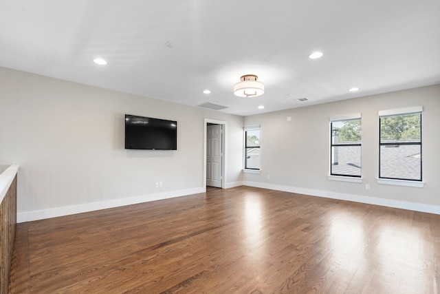 5948 Melshire Dr, Dallas, TX 75230 - unfurnished living room featuring dark wood-type flooring and recessed lighting