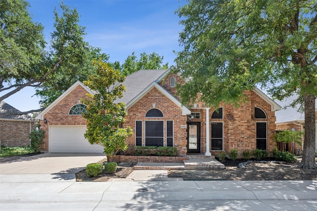 5905 Summer Point Dr, Mckinney, TX 75072 - view of front facade with brick siding and concrete driveway