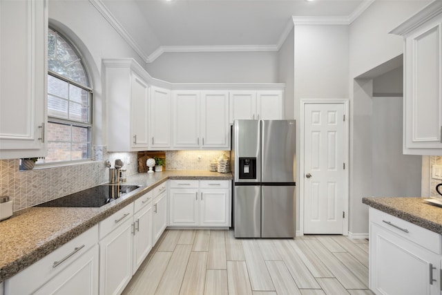 5905 Summer Point Dr, Mckinney, TX 75072 - kitchen with backsplash, white cabinets, stainless steel fridge, and black electric stovetop