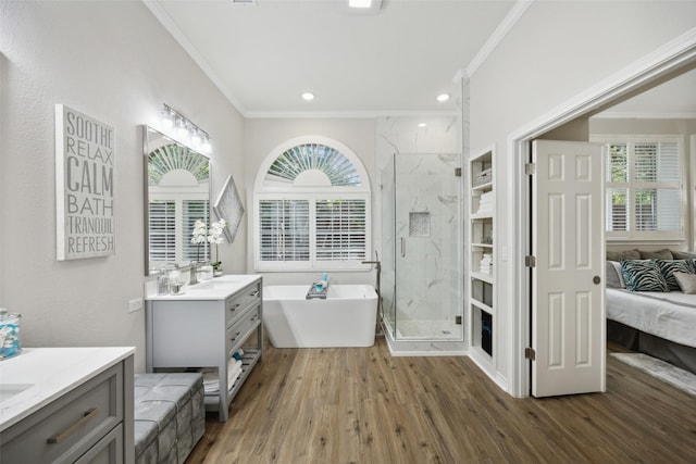 5905 Summer Point Dr, Mckinney, TX 75072 - ensuite bathroom featuring two vanities, crown molding, a marble finish shower, a sink, and wood finished floors