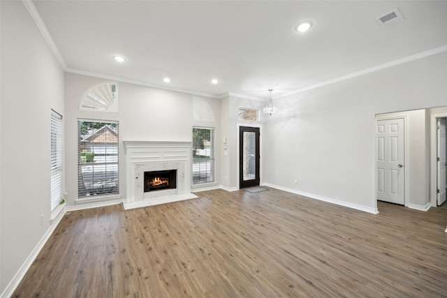 5905 Summer Point Dr, Mckinney, TX 75072 - unfurnished living room with visible vents, baseboards, crown molding, and wood finished floors
