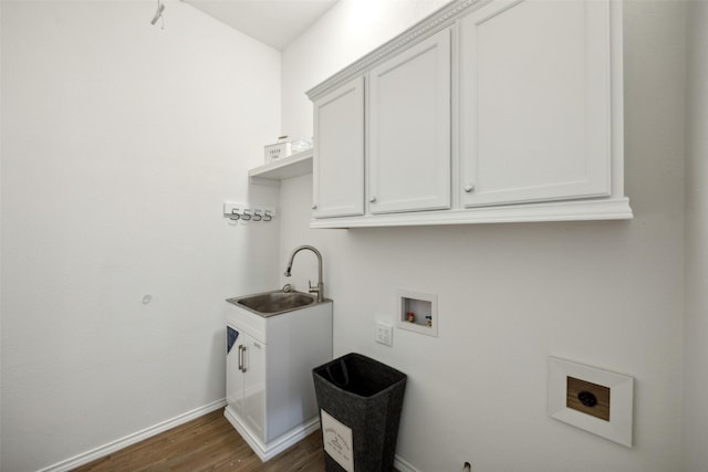 5905 Summer Point Dr, Mckinney, TX 75072 - washroom with dark wood-style flooring, baseboards, washer hookup, cabinet space, and a sink