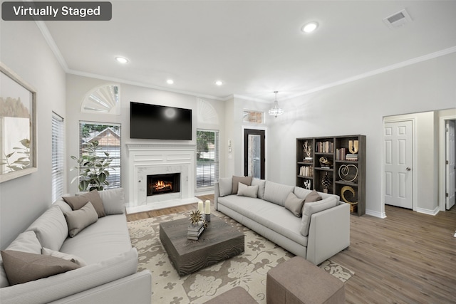 5905 Summer Point Dr, Mckinney, TX 75072 - living room with crown molding, visible vents, recessed lighting, and wood finished floors