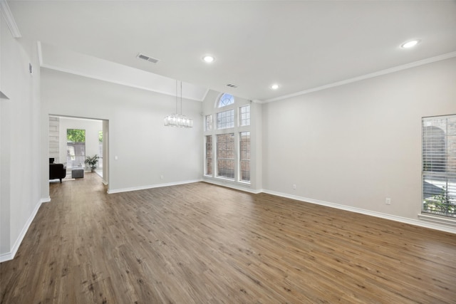 5905 Summer Point Dr, Mckinney, TX 75072 - unfurnished living room featuring visible vents, baseboards, a notable chandelier, and wood finished floors