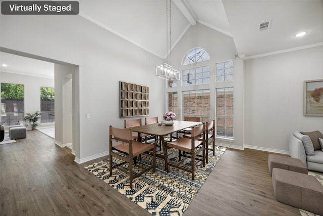 5905 Summer Point Dr, Mckinney, TX 75072 - dining area with a chandelier, high vaulted ceiling, visible vents, and wood finished floors